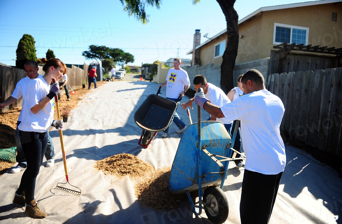 Cleanup crew collecting and bagging event waste